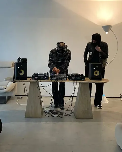 TikTok slideshow cover: Two DJs performing